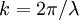 k = 2 \pi/ \lambda \!